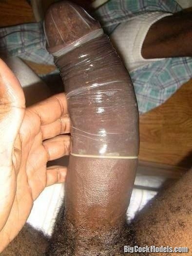 Selfie of a black cock with condom